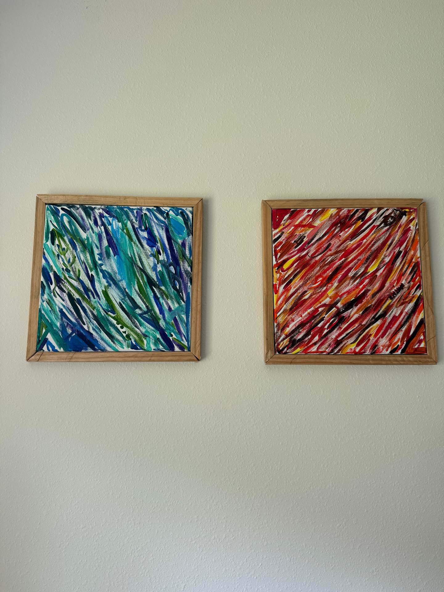 Two framed abstract paintings, blue and red